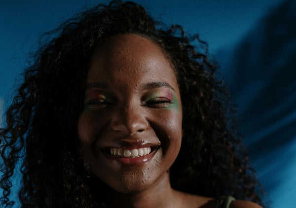 smiley teenager with blemished skin