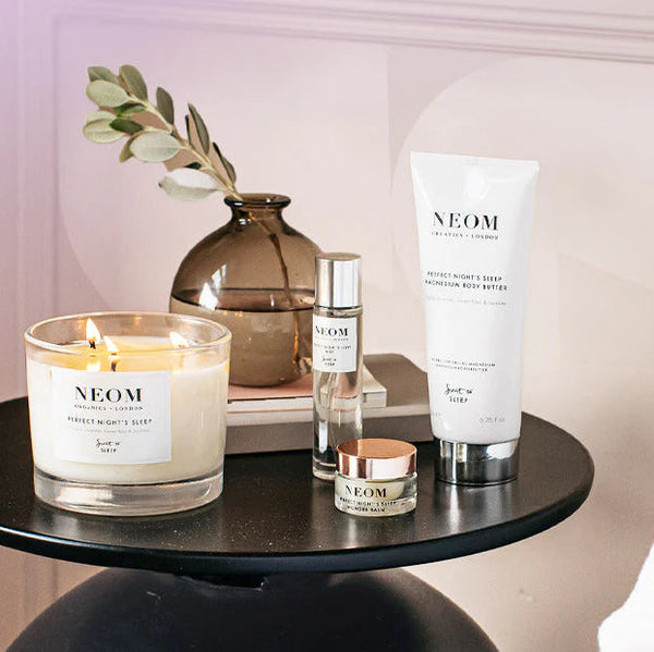 Luxury candles and reed diffusers styled in a calming spa-inspired home setting