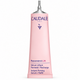 A pink squeeze tube of Caudalie Paris Resveratrol-Lift Serum Refill, featuring a silver metal applicator tip, on a clean white background.