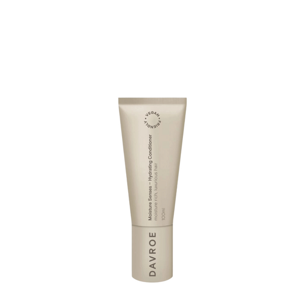 A beige squeeze tube of Davroe Moisture Serum Hydrating Conditioner on a solid white background.