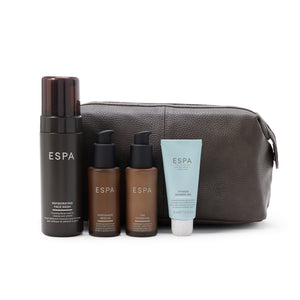 Espa skincare products including bottles and a tube with a brown leather pouch on a white background.