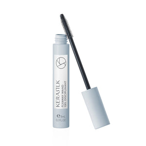 Eyelash serum with applicator on a white background