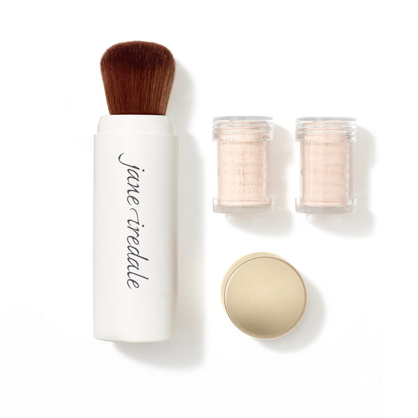 Makeup brush set with containers and a compact on a white background, featuring the brand 'jane iredale'.