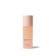 A bottle of Omorovicza Queen Essence Facial Essence in a soft peach-pink shade, featuring a matching pale pink cap, set against a clean white background with a soft shadow.
