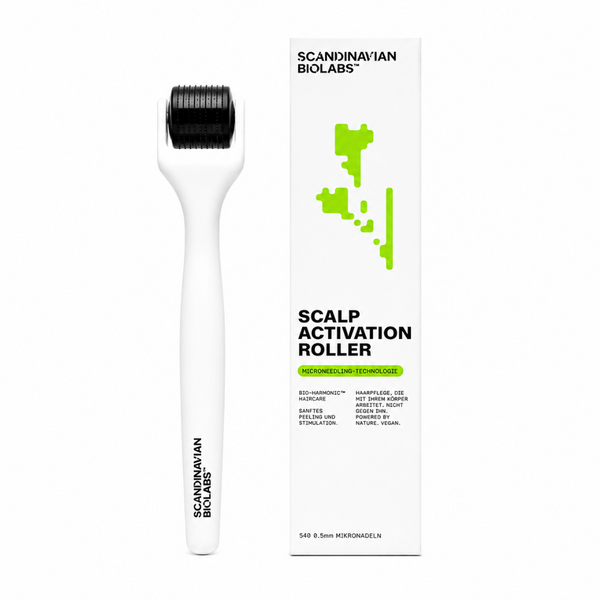 A white scalp activation roller tool with black micro needles on the roller head, shown next to its white packaging box featuring green and black text and graphics. The brand Scandinavian Biolabs is clearly visible on both the tool and the box.