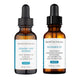 Two bottles of SkinCeuticals skincare products on a white background