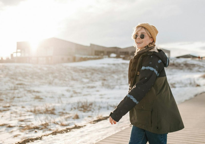 Smiling lady enjoying the winter sun