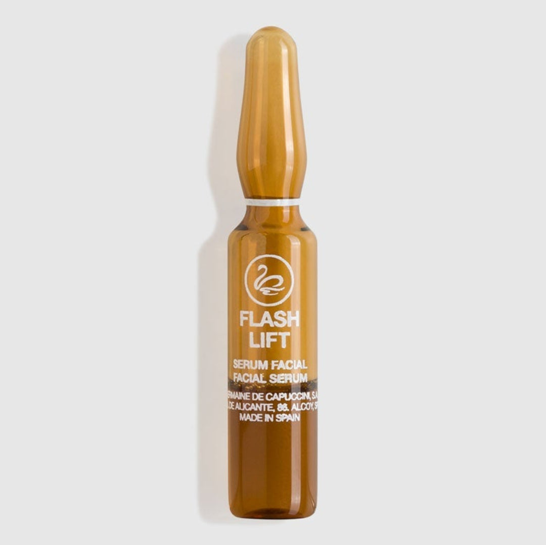 Amber glass serum bottle labeled 'Flash Lift' on a white background