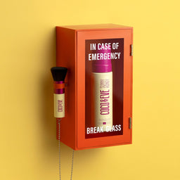 Coco & Eve Sunny Honey Deluxe Vegan Kabuki Brush inside a break in case of emergency case