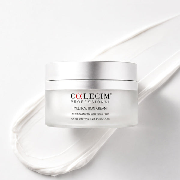 A jar of Colecim Professional Multi-Action Cream on a white background with a white cream smear behind it.