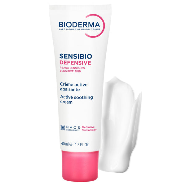 Bioderma Sensibio Defensive active soothing cream in a 40 ml white squeeze tube with a pink cap, shown alongside a white smear of cream on a clean white background.
