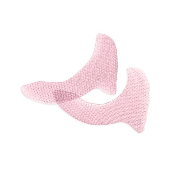 Two light pink textured silicone or mesh adhesive patches with curved, hook-like shapes, shown overlapping on a solid white background.