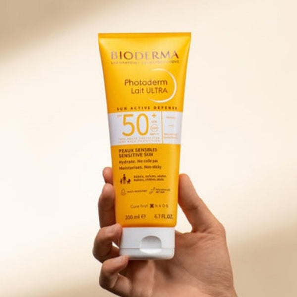 Model holding Bioderma Photoderm Lait ULTRA SPF 50+ for Sensitive Skin