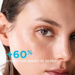 Close-up of a woman's face with bright, hydrated skin and overlaid text reading '+60% HYDRATION BOOST IN 30 MIN'.