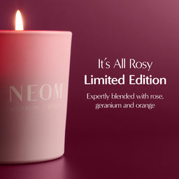 NEOM candle with 'It's All Rosy Limited Edition' text on a dark background
