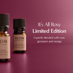 NEOM essential oil blend bottle on a purple background with text about the limited edition product.