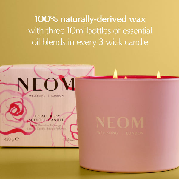 NEOM candle and packaging on a yellow background