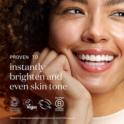 Woman with a radiant smile, text about skin tone improvement, and certification logos.