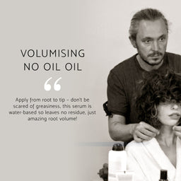 A promotional graphic for a hair serum with the text 'VOLUMISING NO OIL OIL' and a quote about applying it from root to tip. The photo shows a man styling a woman's curly hair in a salon setting, with product bottles visible in the foreground.