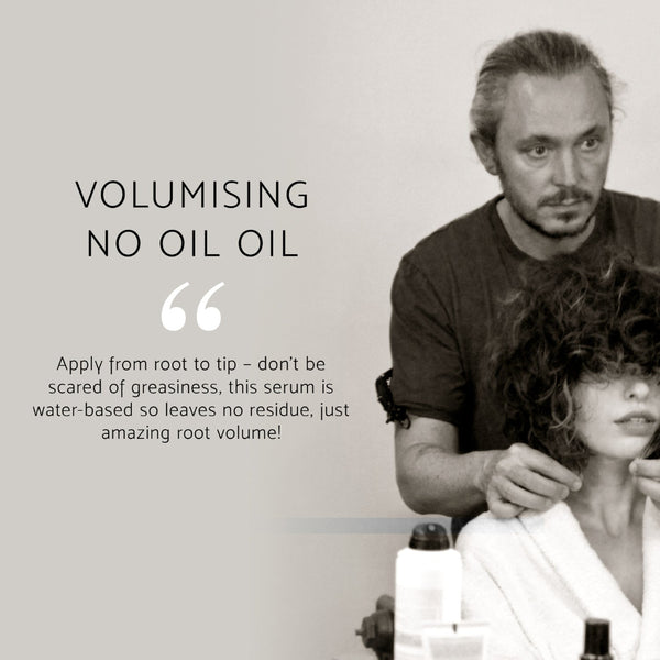 A promotional graphic for a hair serum with the text 'VOLUMISING NO OIL OIL' and a quote about applying it from root to tip. The photo shows a man styling a woman's curly hair in a salon setting, with product bottles visible in the foreground.