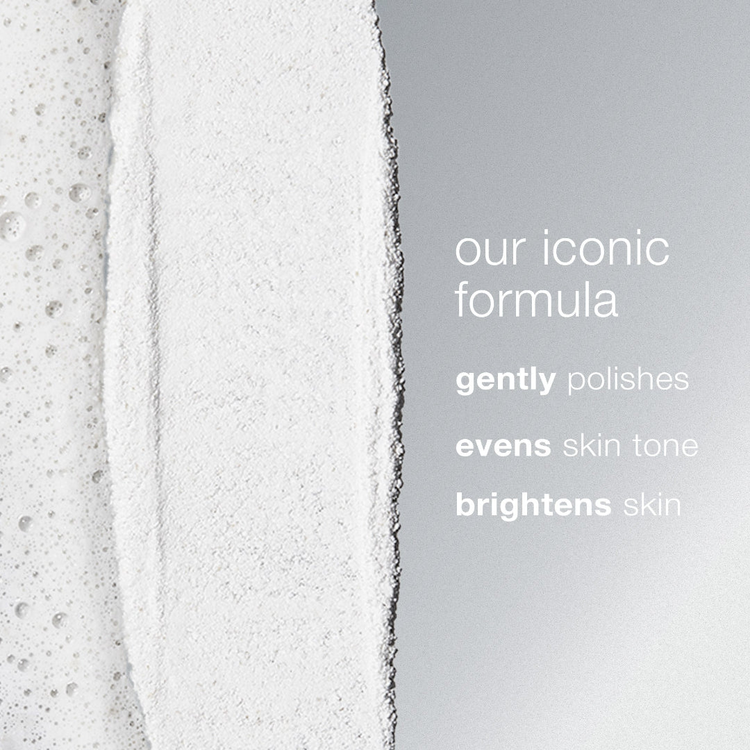 Close-up of a skincare product with text describing its benefits on a gray background
