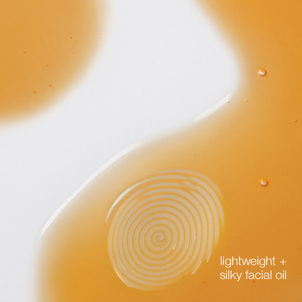 Close-up of a facial oil with concentric circles and text 'lightweight + silky facial oil' on a white background.