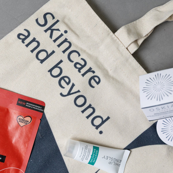 Tote bag with skincare products and 'Skincare and beyond' text on a gray background