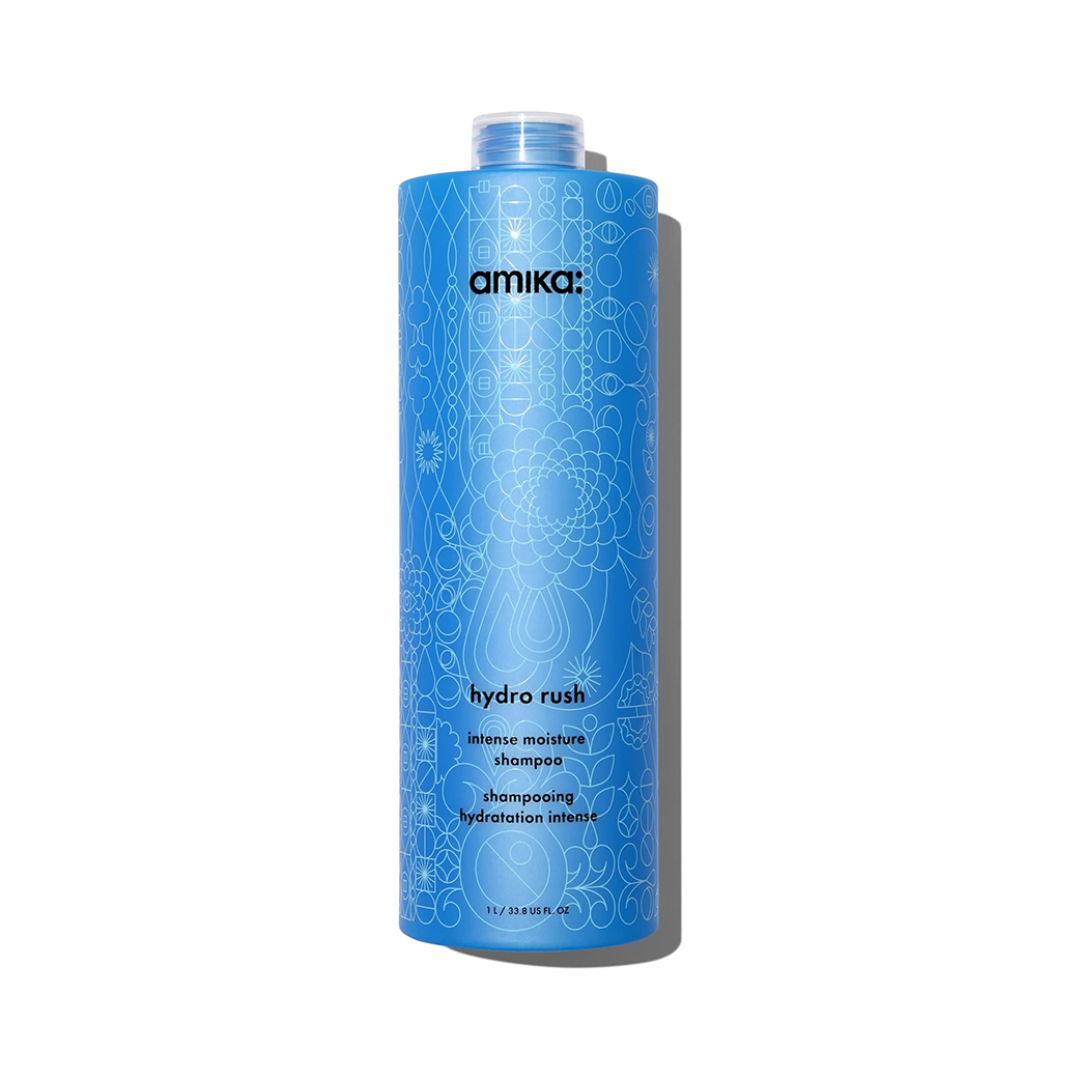Blue shampoo bottle with 'amika' branding on a white background