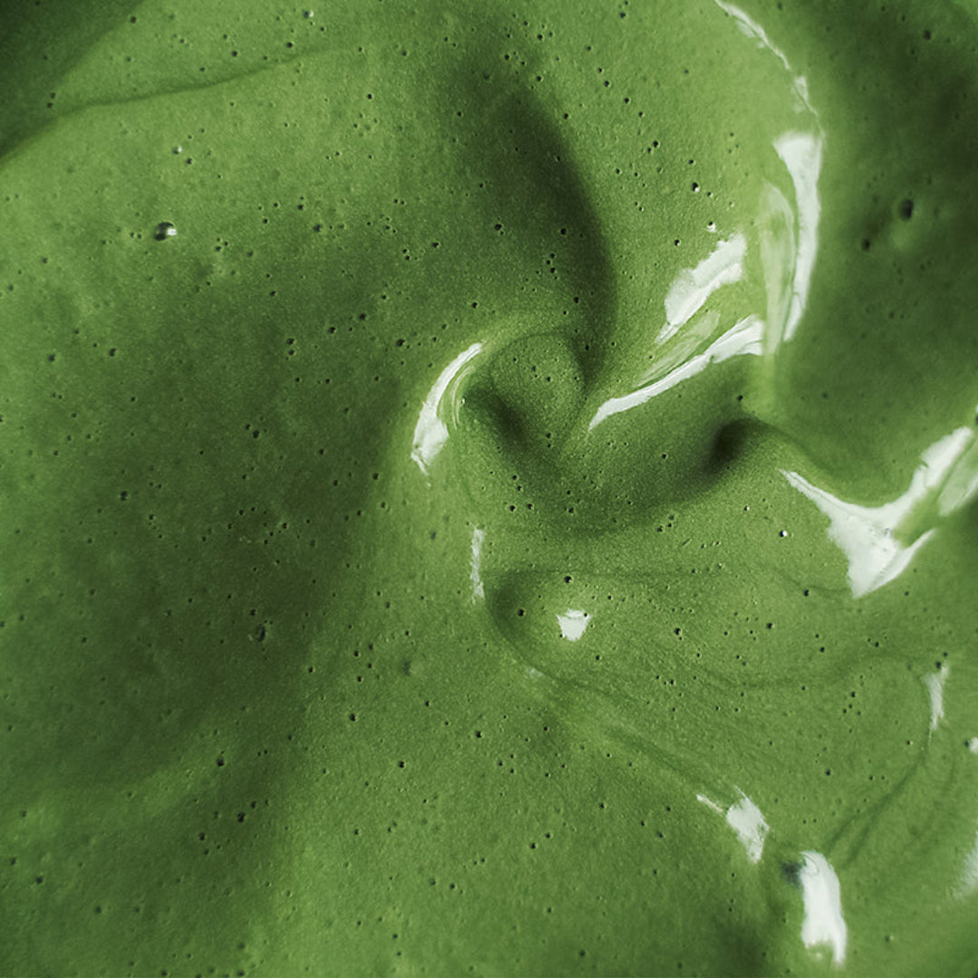 Close-up of green smoothie texture with swirls