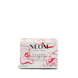 NEOM scented candle packaging with floral design on a white background