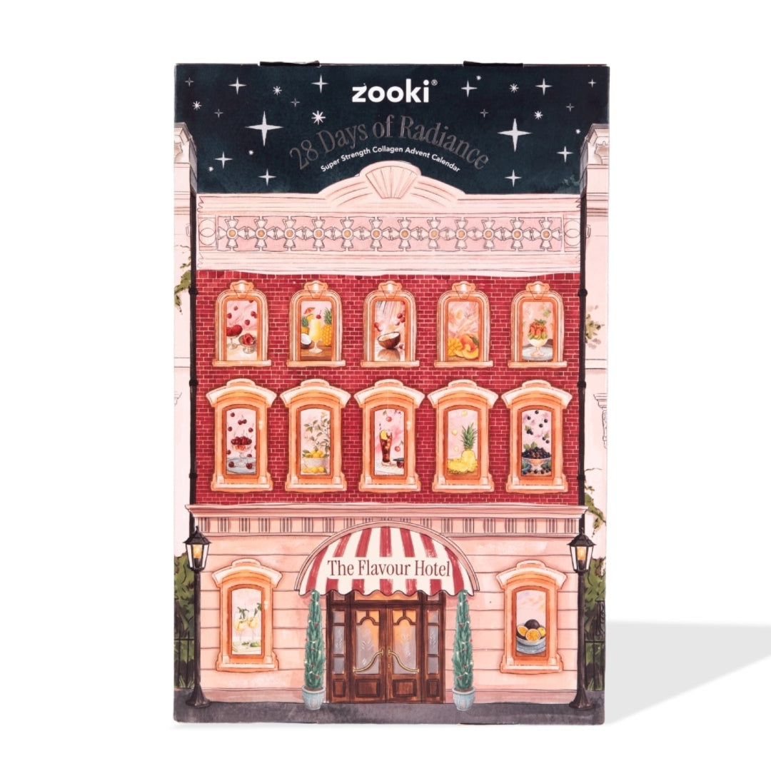 Zooki 28 Days of Radiance New Brave Longer Advent Calendar, designed as a vintage pink and red brick building with illustrated windows and a starry night sky header.