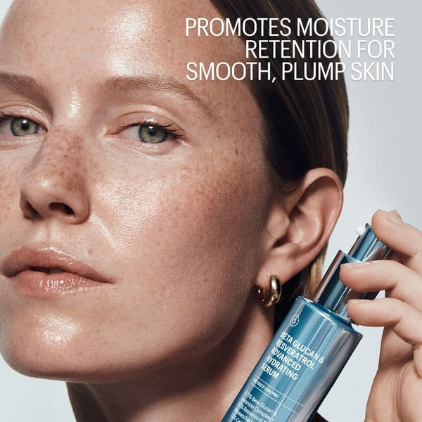 Person holding a skincare product with text about moisture retention on a plain background