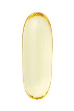 Yellow gel cap on a white background