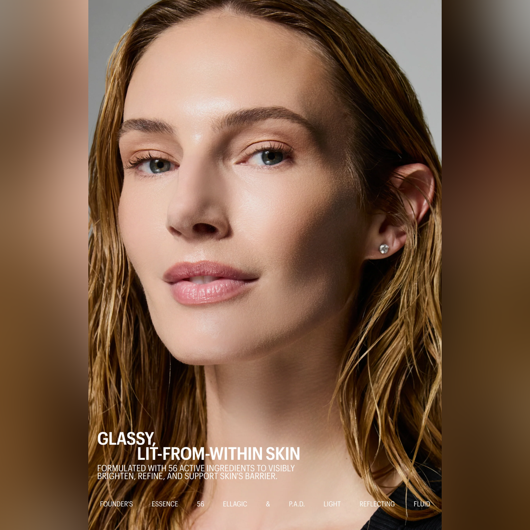 Close-up beauty portrait of a woman with wet light brown hair and subtle skin glow, wearing a small stud earring. Text at the bottom reads 'GLASSY, LIT-FROM-WITHIN SKIN' with skincare branding along the bottom edge.