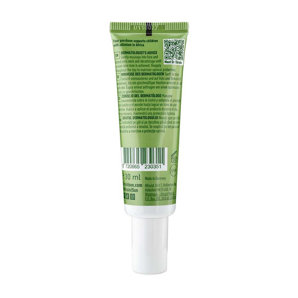 Green tube of skincare product on a white background