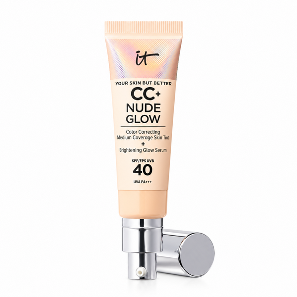 A squeeze tube of it CC+ Nude Glow Color Correcting Medium Coverage Skin Tint + Brightening Glow Serum SPF 40, shown with its silver pump dispenser lying horizontally on a clean white background.