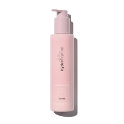 Pink bottle with pump dispenser on a white background