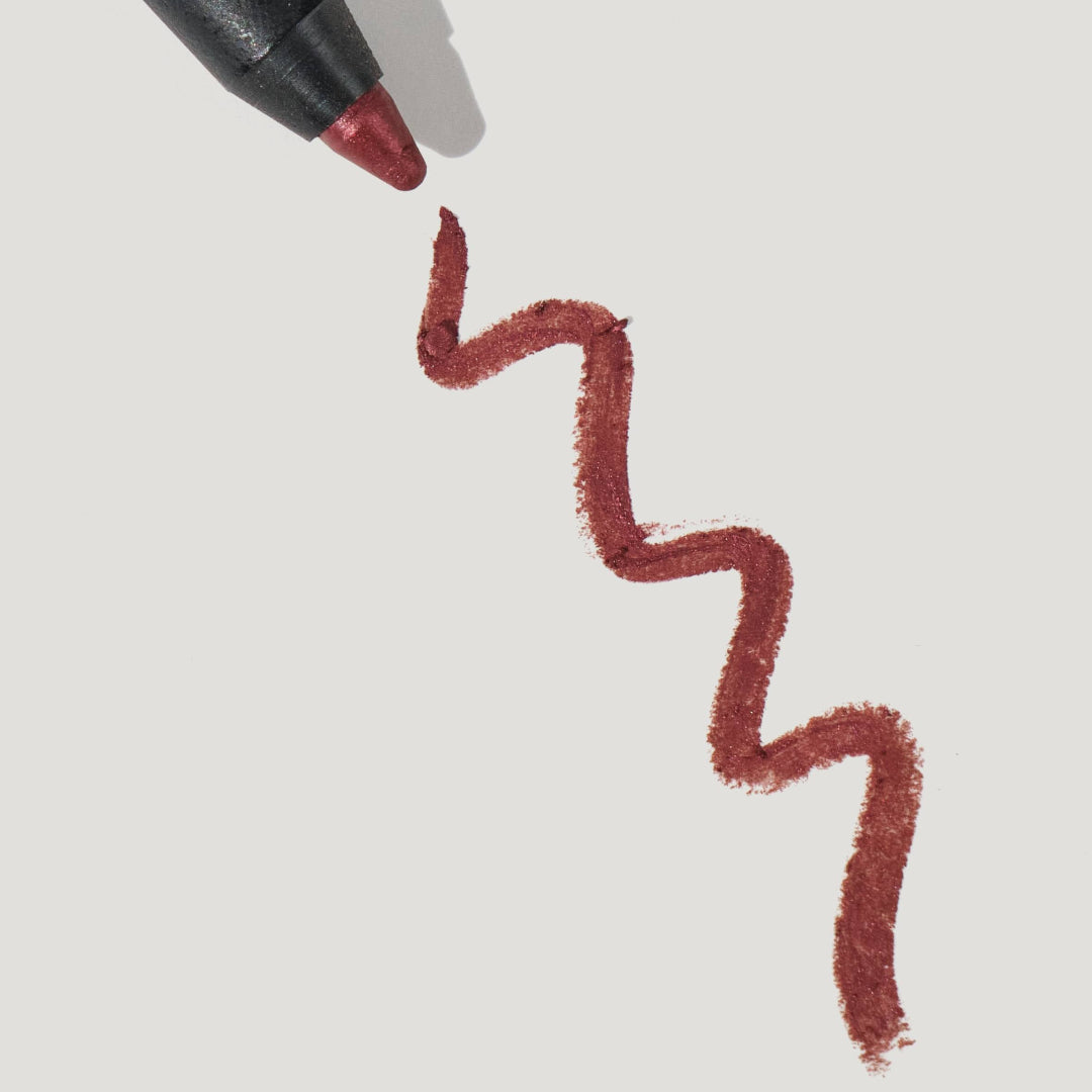Lip liner pen with a red line on a light gray background