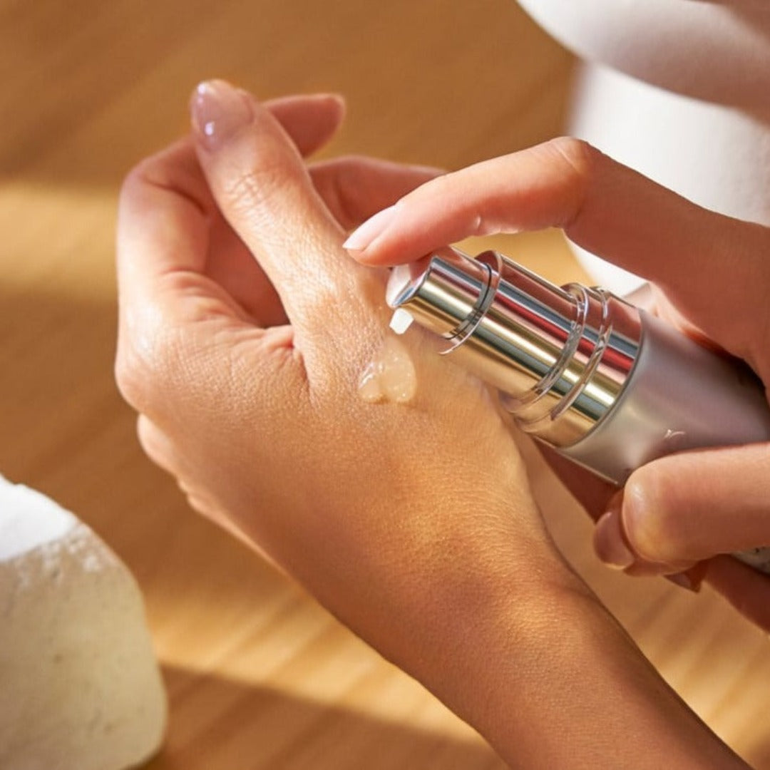 Natura Bisse Glyco Extreme Peel being applied to a hand