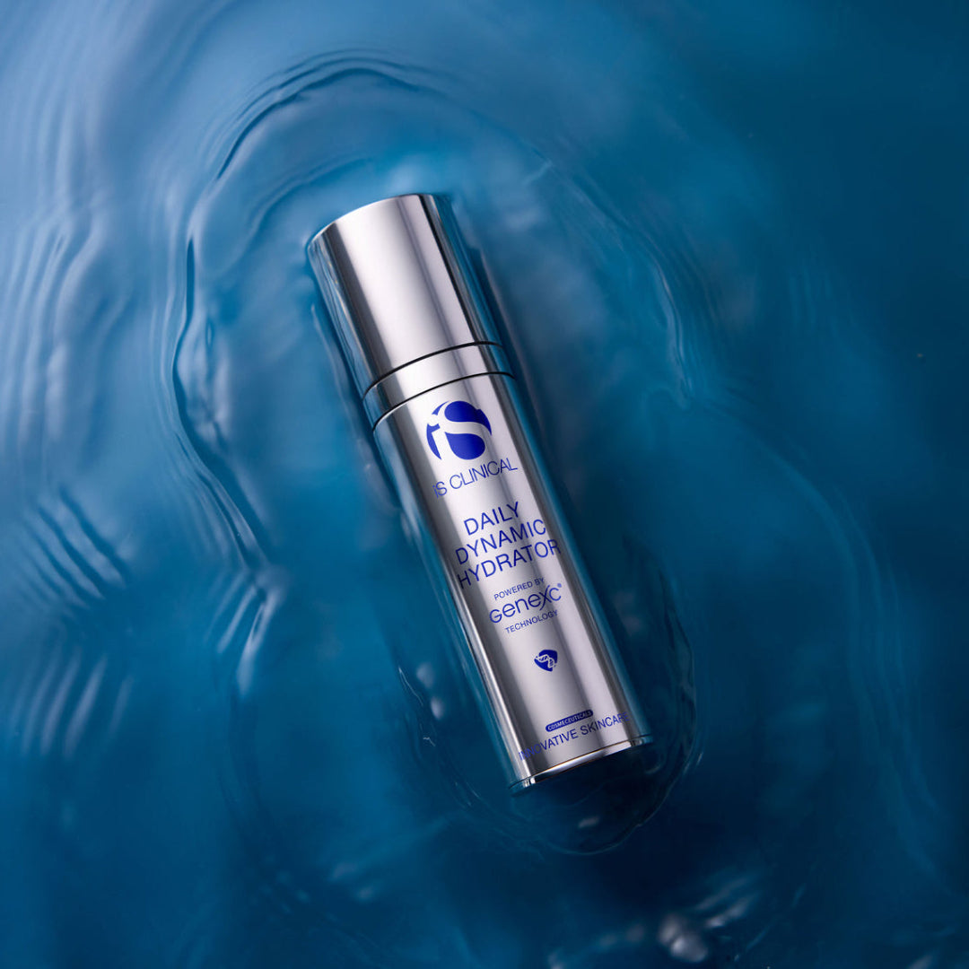 Skincare bottle labeled 'Daily Dynamic Hydrator' on a blue water background