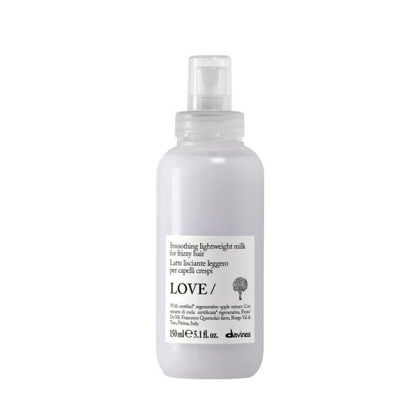 Clear spray bottle labeled 'LOVE' on a white background