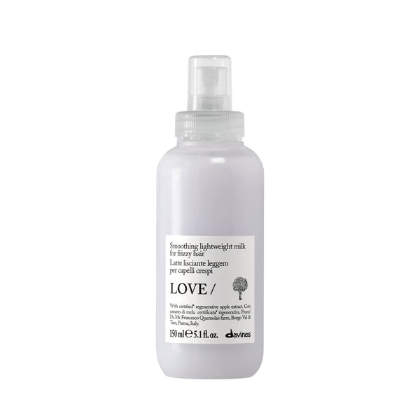 Clear spray bottle labeled 'LOVE' on a white background