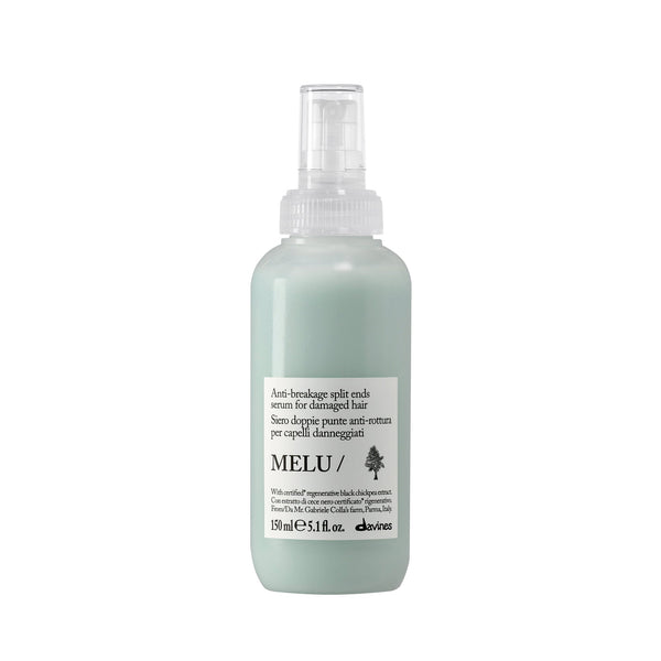 A white plastic spray bottle of Pride & Groom Dog Days De-Tangling Coat Spray for all dogs, featuring a label with reddish-brown hair imagery and white text, on a solid white background.