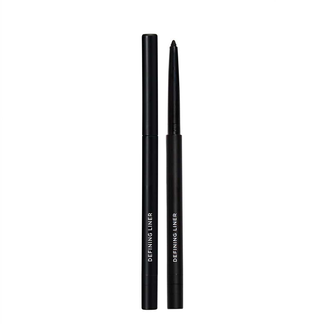 Black eyeliner pen with cap on a white background