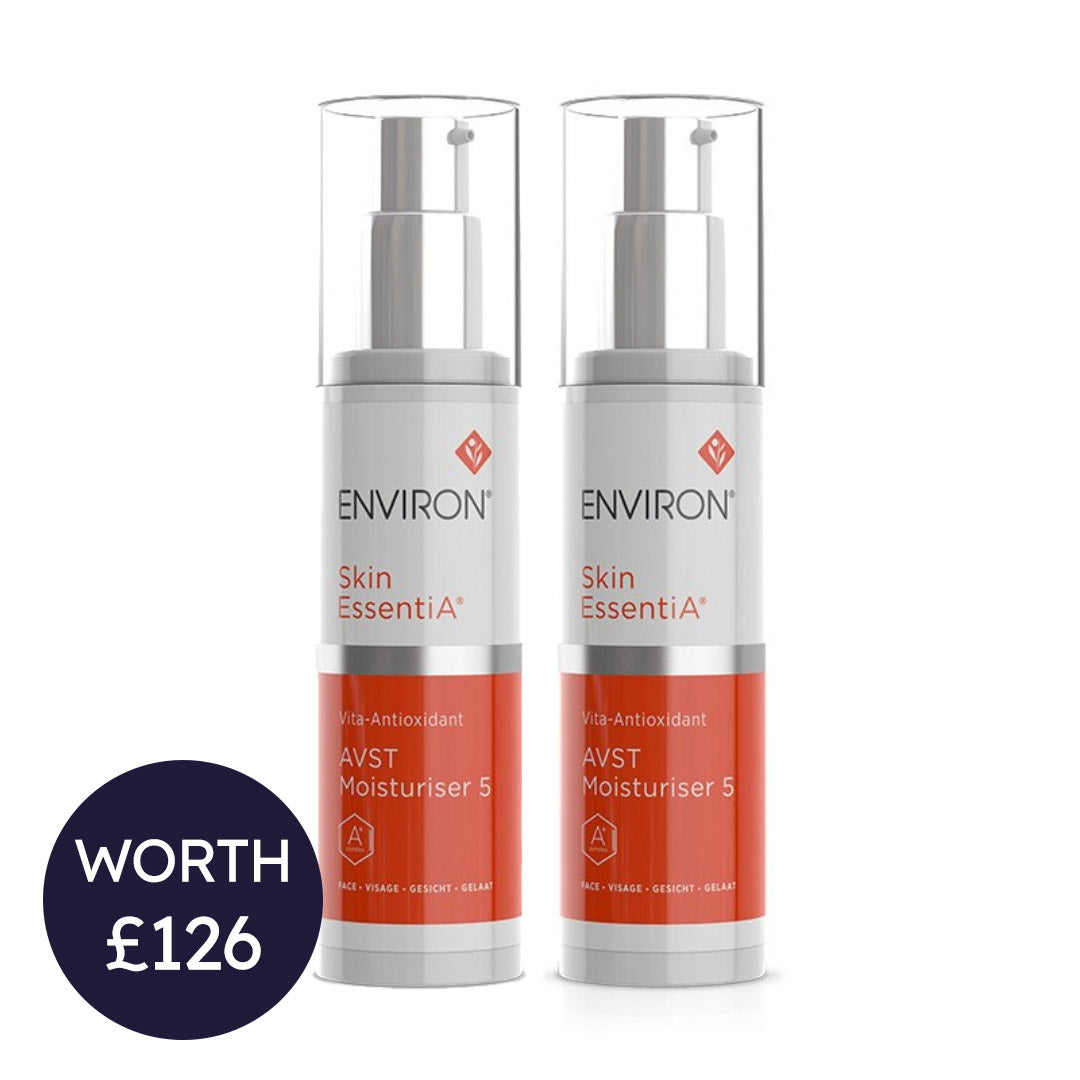 Two skincare bottles labeled 'Environ Skin EssentiA' on a white background with a price tag label.