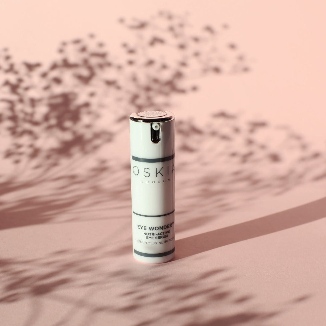 OSKIA Eye Wonder bottle on a pink background
