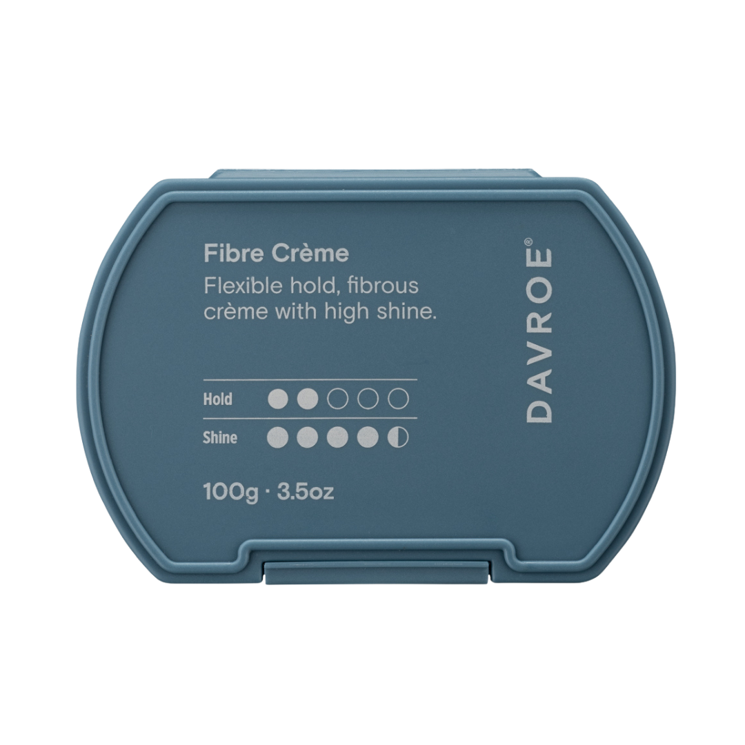 Blue container of Davroe Fibre Crème hair product on a white background