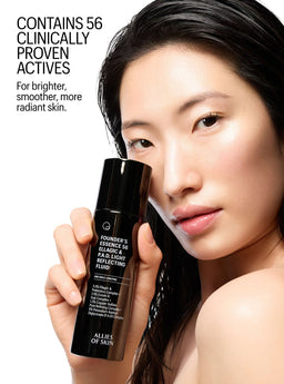 Woman holding a skincare product with text about clinically proven actives on a white background