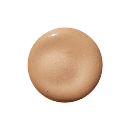 Beige cosmetic cream on a light gray background