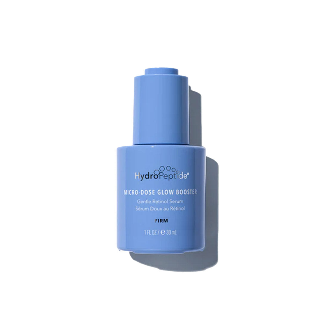 A blue bottle of HydroPeptide Micro-Dose Glow Booster serum on a white background.